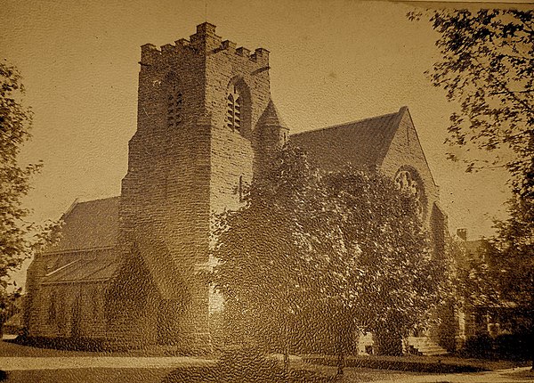 Church building ca. 1910. Note the rose window above the west door; the window was replaced after the First World War with the Archangel Michael memor