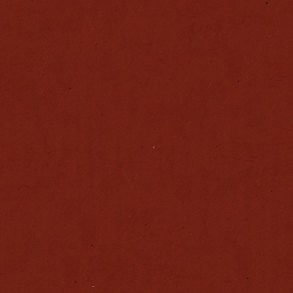 File:Dark red garnet painted speckled concrete seamless building
