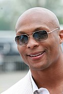 A picture of Eddie George wearing sunglasses.