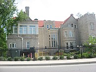 Large gated stone mansion