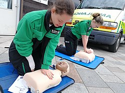 Two St John Ambulance Cadets performing CPR on a Little Anne; a type of Medical education mannequin