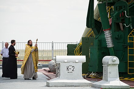 A Russian Orthodox priest blesses the Soyuz rocket for ISS Expedition 31