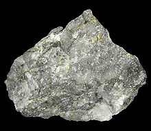 High-grade gold ore from a quartz vein near Alma, Colorado. The appearance is typical of very good gold-quartz ore. Gold-Quartz-273364.jpg