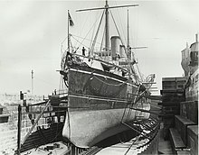 The bow of HMS Royal Arthur while drydocked in Sydney. HMS Royal Arthur in drydock Sydney.jpg