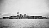 A black and white picture of a large ship being used as an aircraft carrier