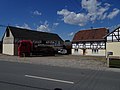 House and side building of a three-sided courtyard