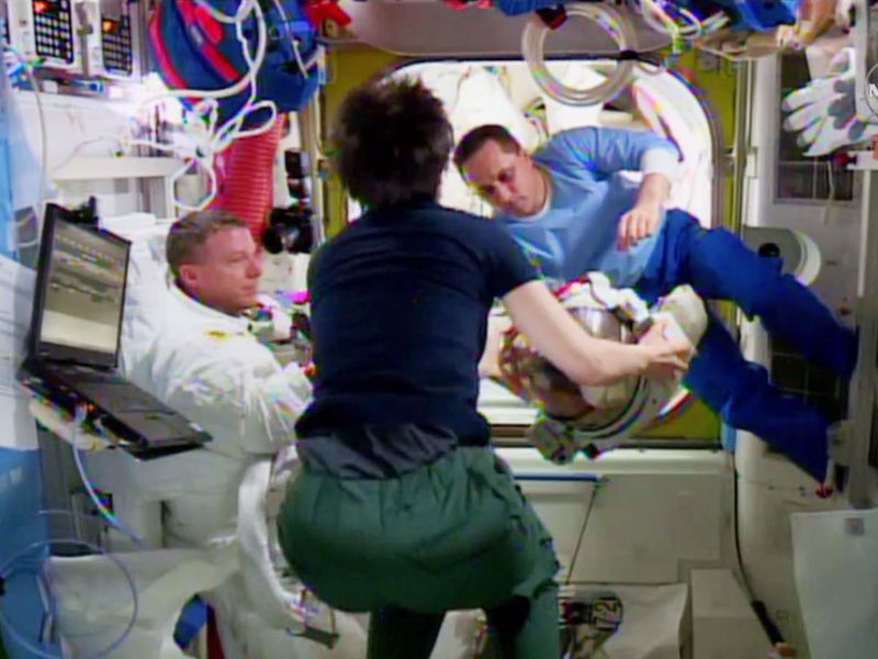 File:ISS-42 EVA-2 (c) checking out the spacesuit helmet.jpg