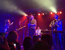 James Marriott (centre), performing at The Garage, 2023, with band members (from left to right) Horsley, Gavin, Shakoori and Suter James Marriott.jpg