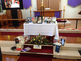Memorial service for Jeffrey Grey at the Anzac Chapel at the Royal Military College,Duntroon. His image is surrounded by his books and an autographed rugby ball. Jeff Grey Memorial Service.jpg