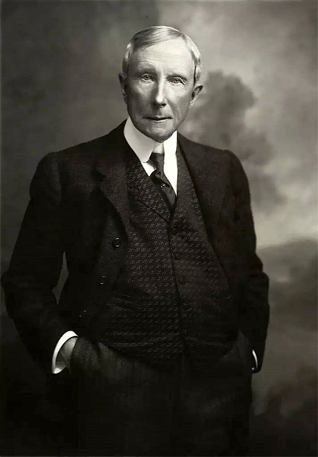 John D. Rockefeller, Sr. and his son John, Jr. leave a wedding in