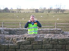 A volunteer stationed at Leahill Turret 51B, one of Cell 27 of the event volunteer 'legions'. Leahill Turret 51B, volunteer at 'Illuminating Hadrian's Wall' 2010.JPG