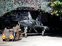 A Mirage IIIRS being towed out of a cavern on Buochs Airport, Switzerland (1999) Mirage 2115 exits cavern Buochs.jpg