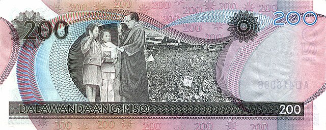 Arroyo displayed on a New Design series two hundred-peso banknote, being sworn in as president by Chief Justice Hilario Davide Jr. in January 2001