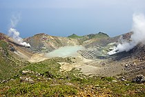 The crater on the highest peak (Otake) in Nakano-shima. The stripes that can be seen at the right in this photograph are disused sulfur mining facilities.