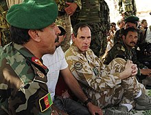 Parker attending a shura in April 2010 with Afghan National Army Brigadier General Akram Sameh Nick Parker shura.jpg