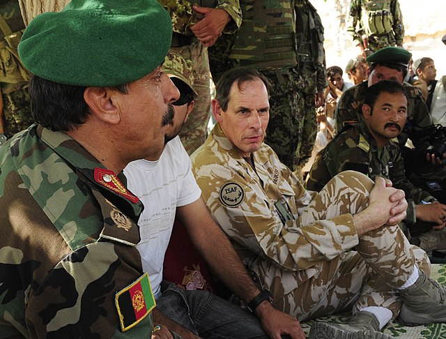Parker attending a shura in April 2010 with Afghan National Army Brigadier General Akram Sameh