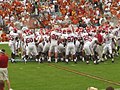 A huddle of OU football players