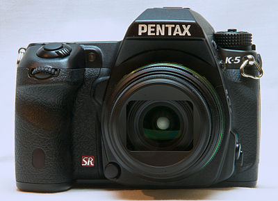 The "box" or "cut-out" type lens hood of a Pentax DA 21 mm f/3.2 Limited lens.