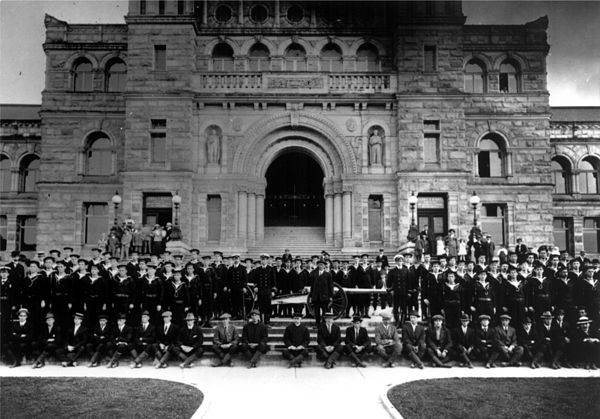 Royal Canadian Naval Volunteer Reserve members stand outside the British Columbia Parliament Buildings in 1914