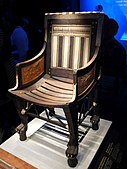 Ancient Egyptian armchair of Tutankhamun; 1336-1326 BC; wood, ebony, ivory and gold leaf; height: 71 cm; Exposition of Tutankhamun Treasure in Paris (2019)