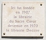 Placa conmemorativa de la Librería del Sacré-Cœur, plaza de Bellecour, Lyon.