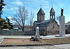 A church in Tskhinvali behind the monument to those killed in the Georgian-Ossetian conflict