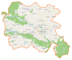 Mapa konturowa gminy Pobiedziska, w centrum znajduje się owalna plamka nieco zaostrzona i wystająca na lewo w swoim dolnym rogu z opisem „Jezioro Biezdruchowskie”