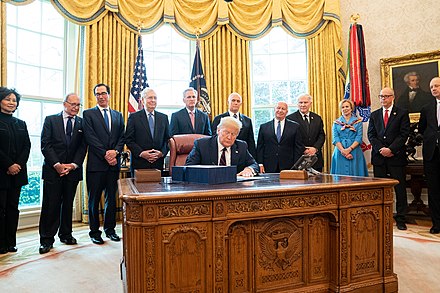 Chabot watches President Donald Trump sign the CARES Act in 2020