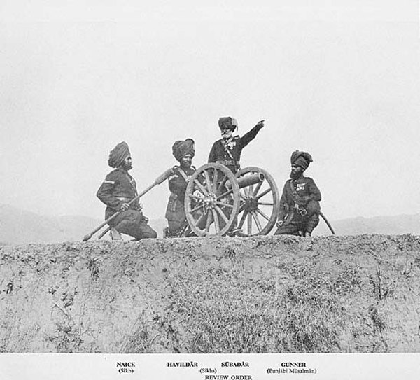 No. 4 (Hazara) Mountain Battery with RML7 pounder "Steel Gun" Mountain Gun in Review Order. Left to right Naick, Havaldar, Subadar (Sikhs) and Gunner 