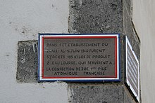 Commemorative plaque at the fuel storage site for Zoe, France's first atomic fuel cell. Riom - Prison (2).JPG