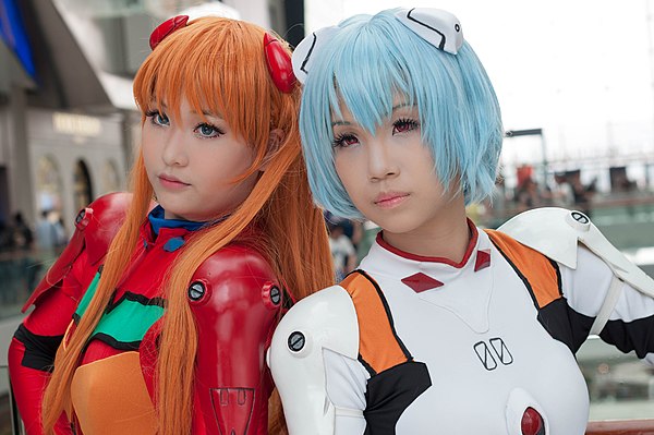 Two cosplayers portraying Asuka Langley Soryu and Rei Ayanami. The franchise has been credited as a conduit for making cosplay a worldwide phenomenon.