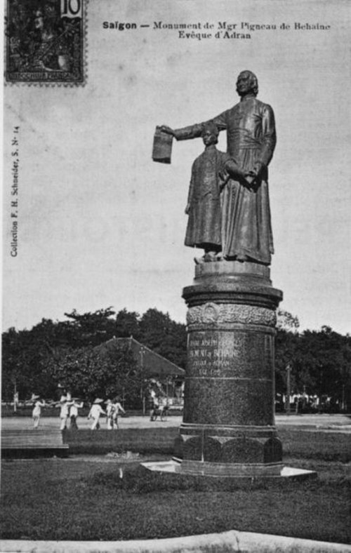 Statue of Pigneau de Béhaine, with Prince Canh, holding the Treaty of Versailles, in Saigon.