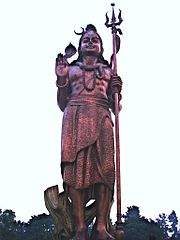 A statue of Hindu God Shiva, holding a trishula, near Indira Gandhi International Airport, Delhi
