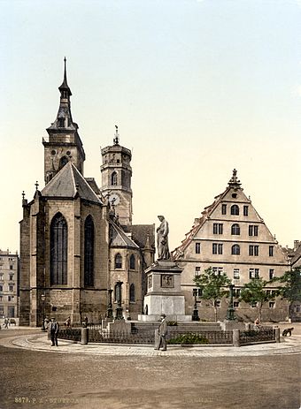 The Protestant Stiftskirche (originally built in 1170, pictured around 1900) with the memorial on Schillerplatz square in foreground