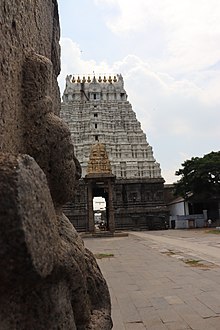 View of the rajagopuram from near a pillar at the entrance Tamil saint.jpg