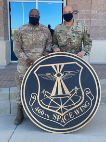 Removal of the 460th Space Wing sign after its deactivation, 7 August 2020. The end of an era (2002477622).png