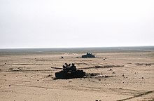 Two destroyed Iraqi T-62 tanks on the battlefield, February 1991. Two destroyed Iraqi T-62 tanks during the Gulf War.JPEG