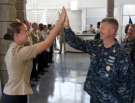 A high five between two U.S. Navy Sailors