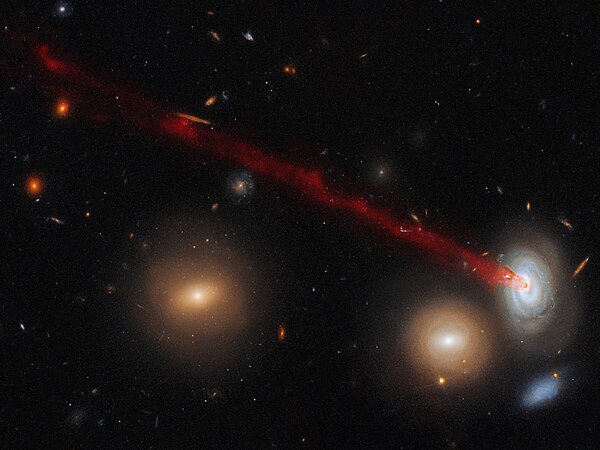 Tails in spiral galaxy D100, found in the Coma Cluster, are created by ram-pressure stripping.