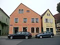 Residential house and outbuildings in open development