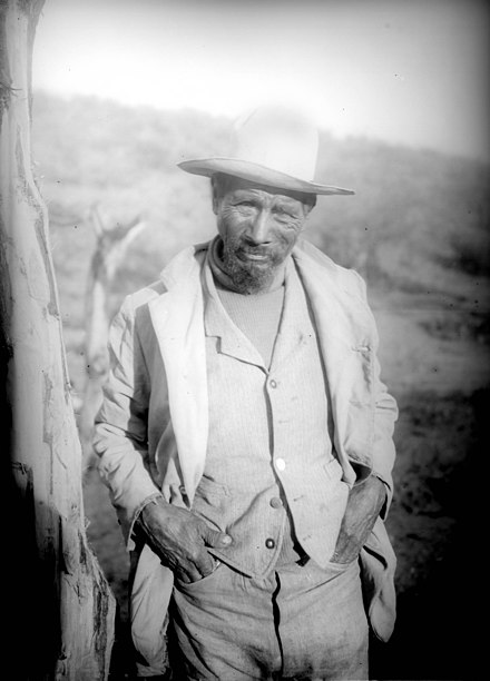 Yaqui Indian man in turtle-neck sweater, vest, and jacket, Arizona, ca.1910 (CHS-4219).jpg
