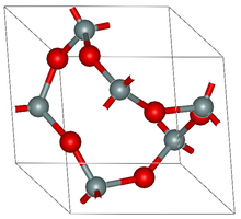 A (large) unit cell of the alpha-quartz crystal net; the black balls are silicon atoms and the red ones are oxygen. A-quartz.png