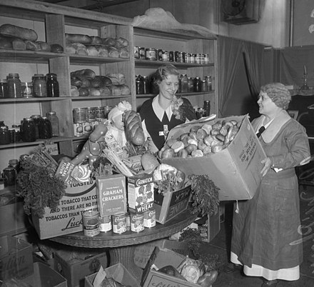 McPherson (left) prepares Christmas food baskets (about 1935)
