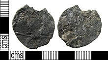 Lead alloy tavern token showing a wine bottle and glass (c. 1670-1800) A post medieval lead alloy uniface Ale or Tavern token which shows a wine bottle and glass dating AD1670- 1800. Powell Class 11. (FindID 741535).jpg