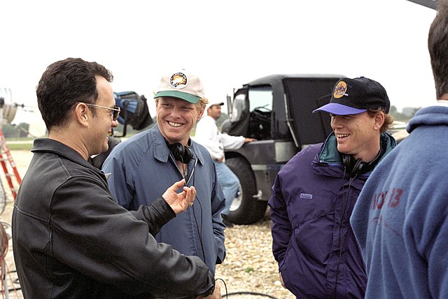 Ron Howard (right) with Tom Hanks (left) and the production crew during filming at the KSC in December 1994