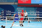 Deutsch: Boxen bei den Olympischen Jugendspielen 2018 Tag 12, 18. Oktober 2018 - Kampf um Bronze im Leichten Schwergewicht Jungen – Karol Itauma (Großbritannien, blau) schlägt Ruslan Kolesnikov (Russland, rot) 4-1; Ringrichter ist Alejandro Barrientos (Kuba). English: Boxing at the 2018 Summer Youth Olympics on 18 October 2018 – Gold Medail Match light heavyweight Boys - Karol Itauma (Great Britain, blue) beats Ruslan Kolesnikov (Russia, red) 4-1; Referee is Alejandro Barrientos (Cuba). Español: Boxeo en los Juegos Olímpicos Juveniles de Verano de 2018 en 18 de octubre de 2018 - Medalla de oro de los hombres de peso pesado ligero: Karol Itauma (Gran Bretaña, azul) vence a Ruslan Kolesnikov (Rusia, rojo) 4-1; El árbitro es Alejandro Barrientos (Cuba).