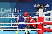 Deutsch: Boxen bei den Olympischen Jugendspielen 2018 Tag 12, 18. Oktober 2018 - Finale Fliegengewicht Mädchen – Martina La Piana (Italien, blau) schlägt Adijat Gbadamosi (Nigeria, rot) 5-0; Ringrichter ist James Beckles (Trinidad und Tobago). English: Boxing at the 2018 Summer Youth Olympics on 18 October 2018 – Girl's flyweight Gold Medal Bout - Martina La Piana (Italy, blue) beats Adijat Gbadamosi (Nigeria, red) 5-0; Referee is James Beckles (Trinidad and Tobago). Español: Boxeo en los Juegos Olímpicos Juveniles de Verano de 2018 en 18 de octubre de 2018 - Combate a medalla de oro de peso mosca para mujeres: Martina La Piana (Italia, azul) le gana a Adijat Gbadamosi (Nigeria, roja) 5-0; El árbitro es James Beckles (Trinidad y Tobago).