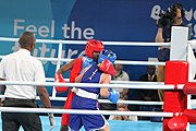 Deutsch: Boxen bei den Olympischen Jugendspielen 2018 Tag 12, 18. Oktober 2018 - Finale Fliegengewicht Mädchen – Martina La Piana (Italien, blau) schlägt Adijat Gbadamosi (Nigeria, rot) 5-0; Ringrichter ist James Beckles (Trinidad und Tobago). English: Boxing at the 2018 Summer Youth Olympics on 18 October 2018 – Girl's flyweight Gold Medal Bout - Martina La Piana (Italy, blue) beats Adijat Gbadamosi (Nigeria, red) 5-0; Referee is James Beckles (Trinidad and Tobago). Español: Boxeo en los Juegos Olímpicos Juveniles de Verano de 2018 en 18 de octubre de 2018 - Combate a medalla de oro de peso mosca para mujeres: Martina La Piana (Italia, azul) le gana a Adijat Gbadamosi (Nigeria, roja) 5-0; El árbitro es James Beckles (Trinidad y Tobago).