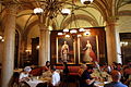 Cafe Central in Vienna interior near portraits of Empress Elisabeth of Austria and Franz Joseph I of Austria