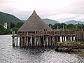 A reconstructed crannog near Kenmore, Perth and Kinross, on Loch Tay, Scotland (show on OSM). The roundhouse burnt down in 2021, unfortunately.
